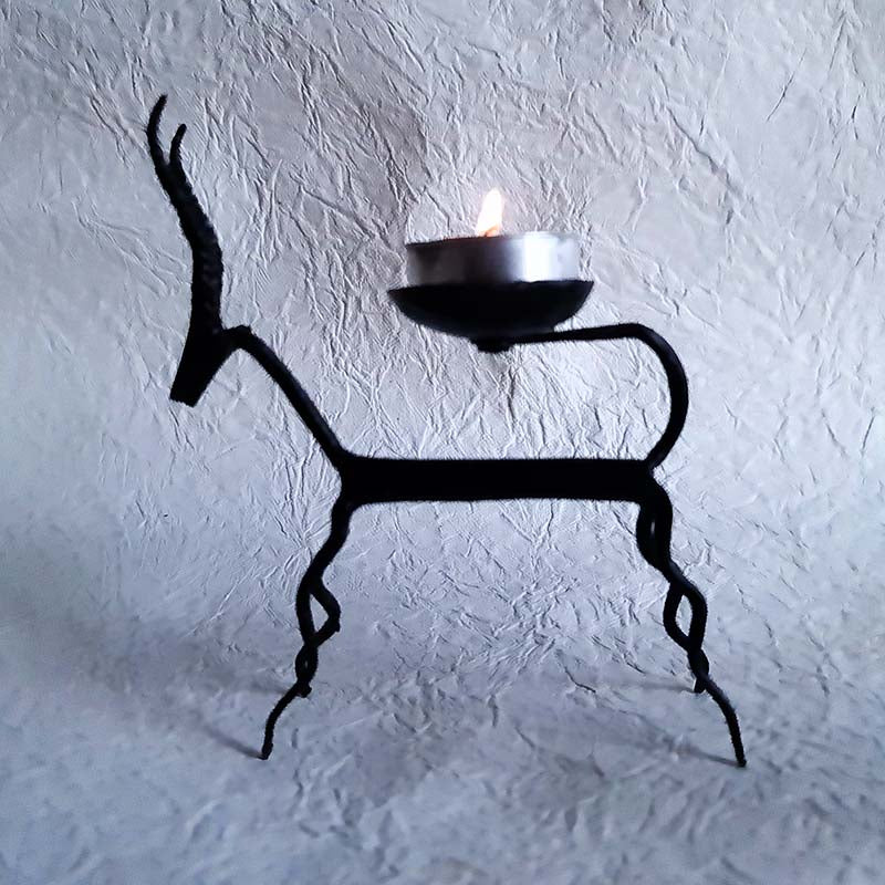 Set of two handmade wrought iron tealight holders featuring deer motifs in the Bastar style