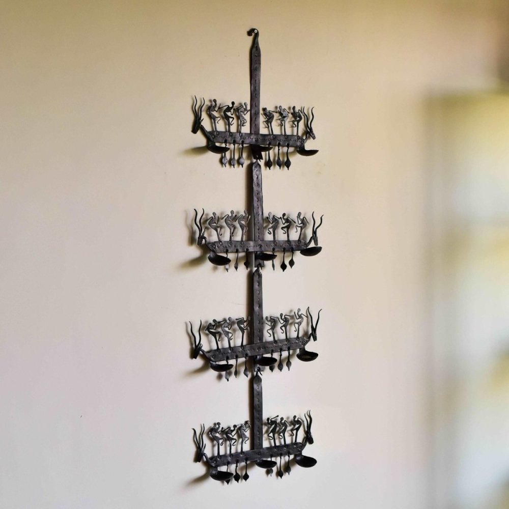 Handcrafted wrought iron decorative stand with intricate Bastar tribal patterns