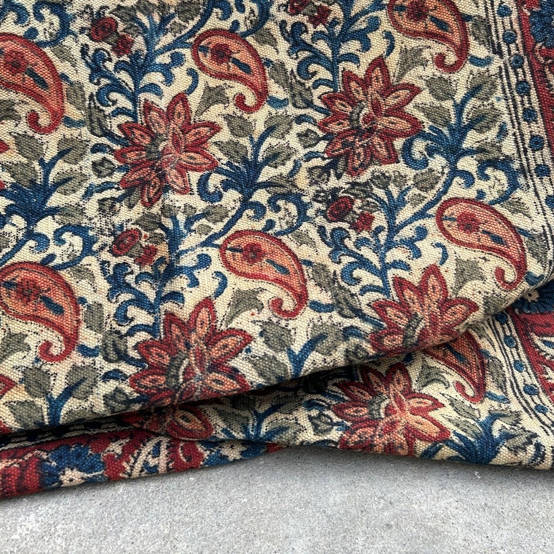 Handcrafted Kalamkari Print Cotton Rug with a Paisley Pattern in Red, Blue, and Beige