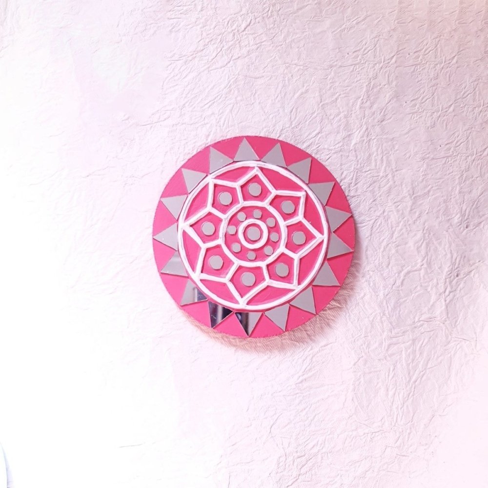 Decorative set of 2 round pink handcrafted mud and mirror work wall art pieces, perfect for adding a subtle pop of color