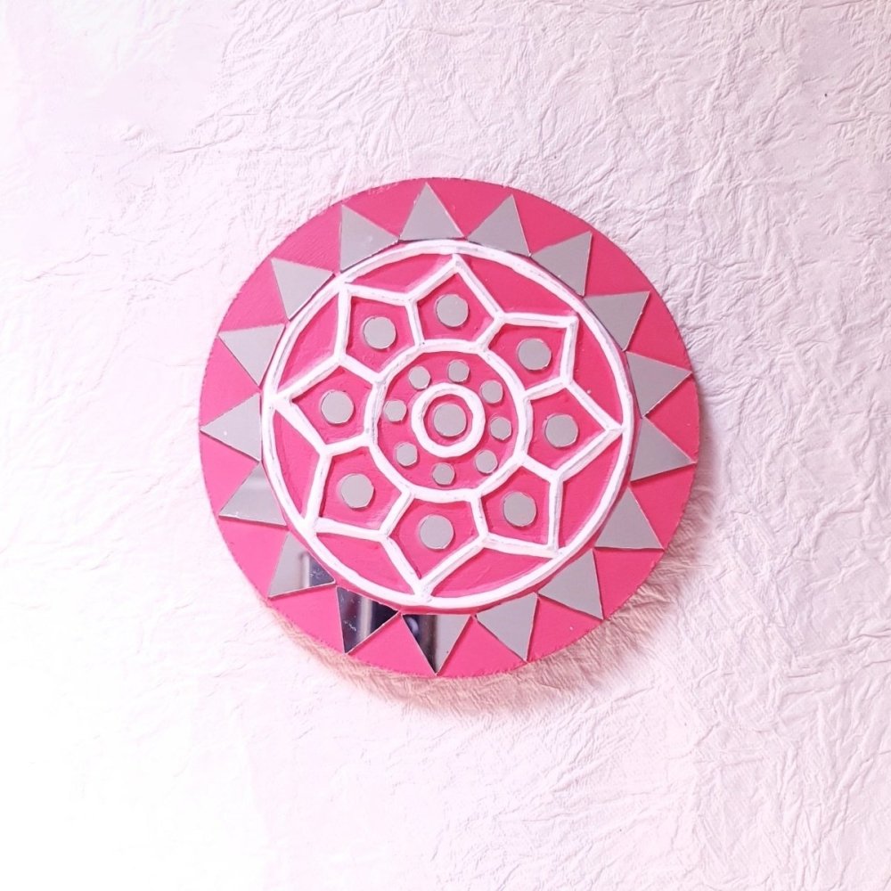 Set of 2 round pink handcrafted mud and mirror work wall art pieces, adding a delicate and artistic touch