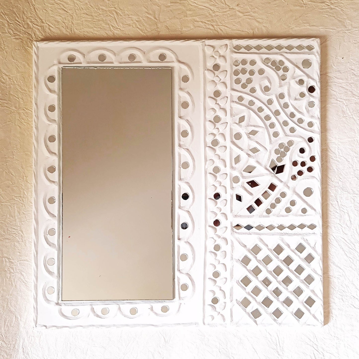 Artisanal white handcrafted mud art wall decor mirror, showcasing traditional craftsmanship 