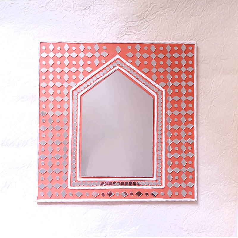 Bright brick red handcrafted mud art mirror, featuring a unique blend of color