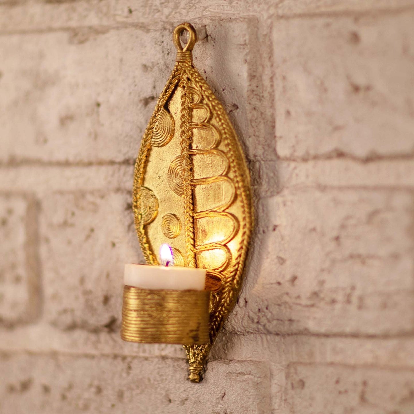 Set of two handmade Dhokra metal leaf-shaped tealight holders