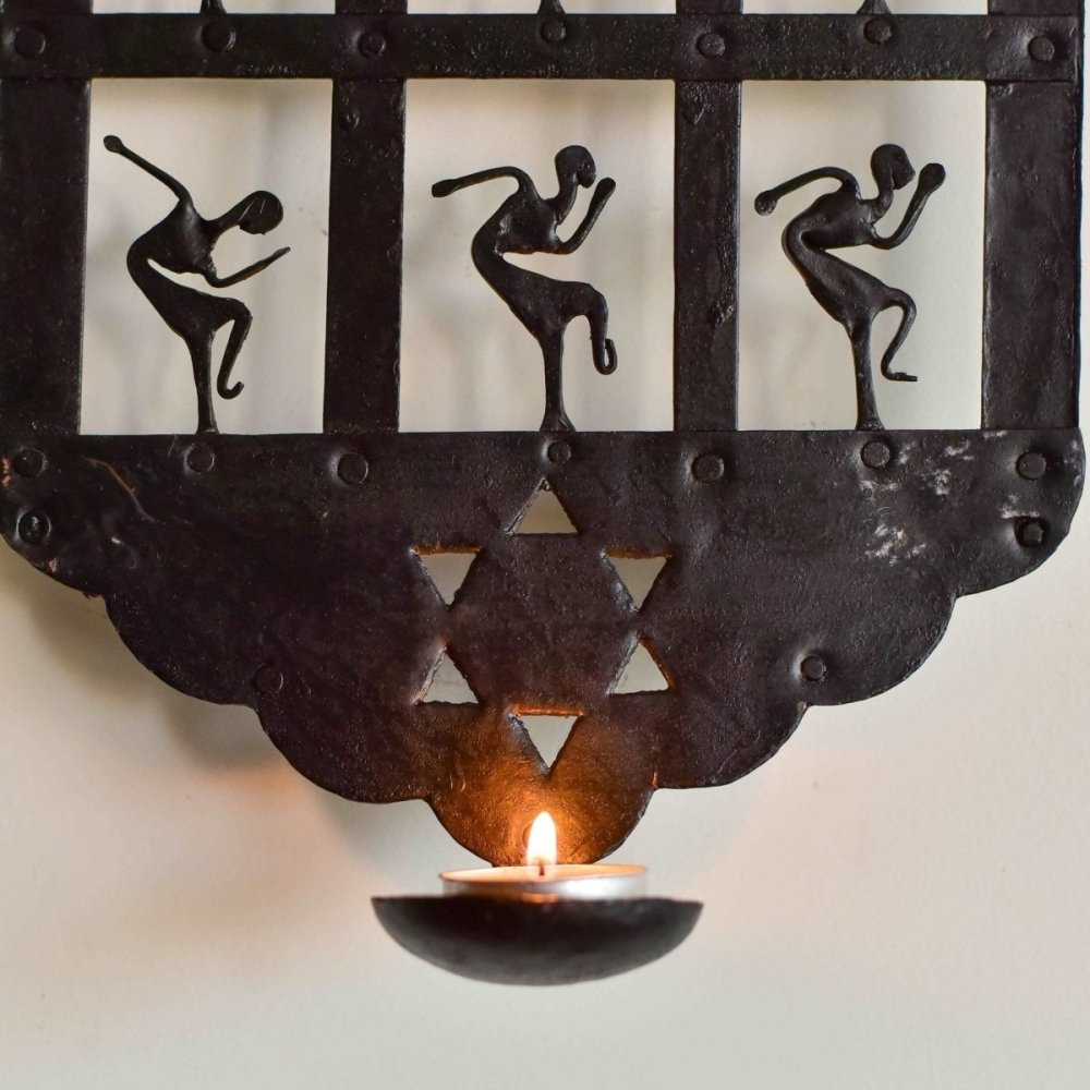 Artisanal candle stand with Bastar tribal art influences, showcasing traditional craftsmanship