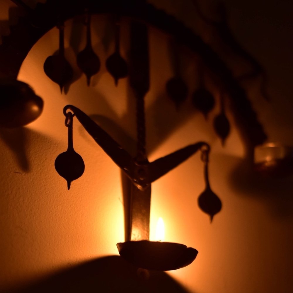 Handmade wrought iron lamp inspired by Bastar tribal art, featuring intricate designs