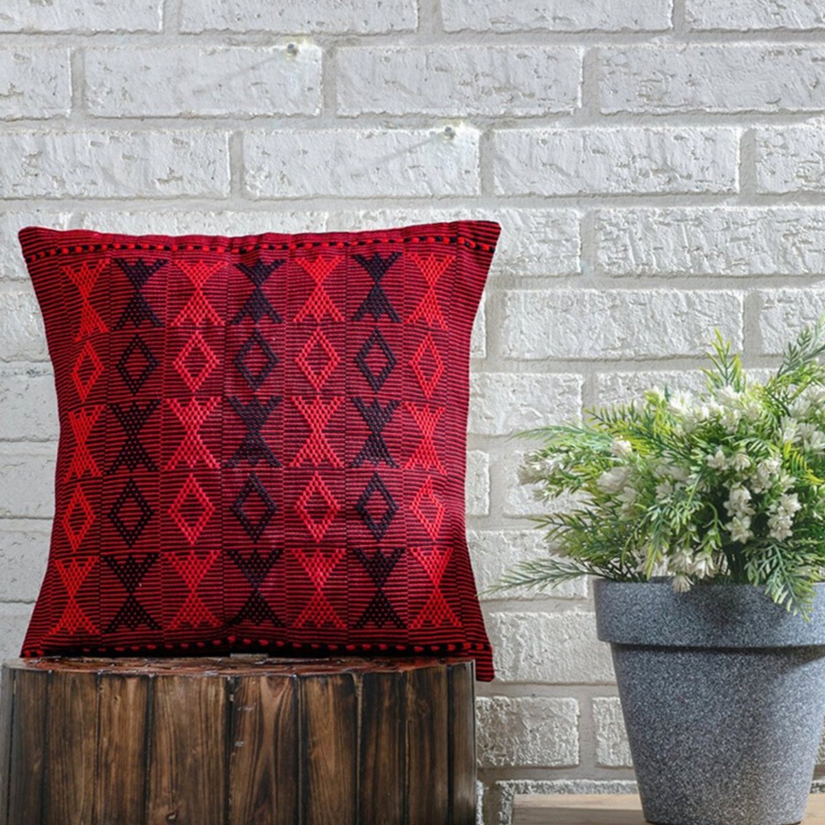 Dramatic Flair: Handwoven Black & Red Arrowhead Pattern Cushion