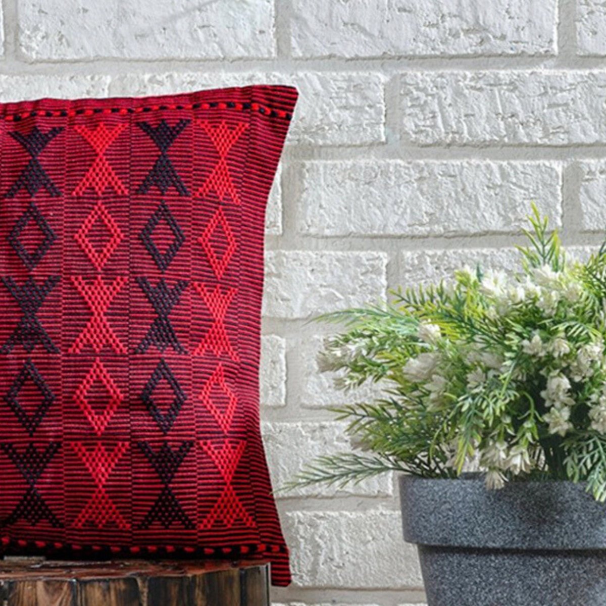 Contemporary Chic: Oversized Black & Red Arrowhead Cushion