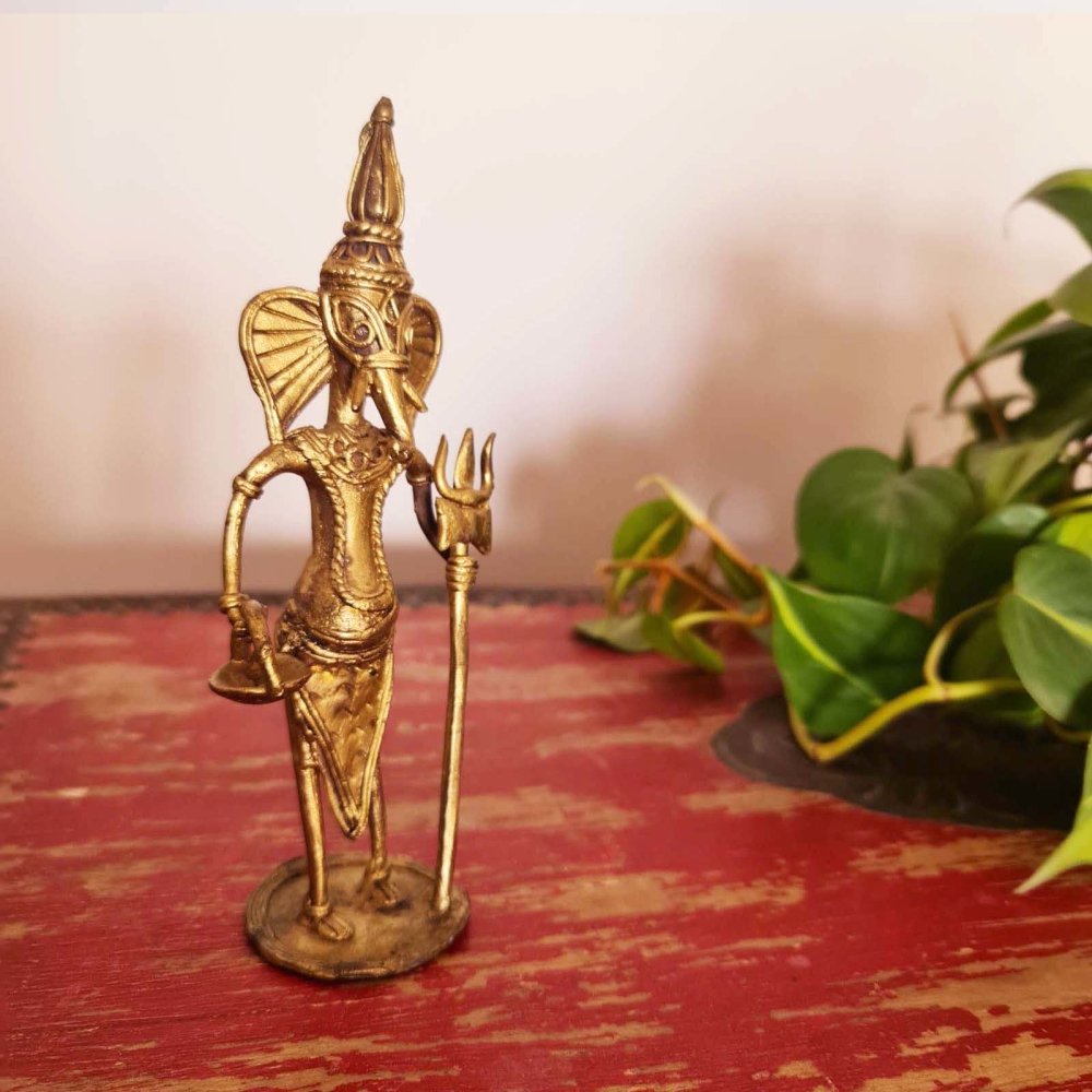 Handmade Dhokra metal figurine of Lord Ganesha, showcasing traditional Indian metalwork craftsmanship