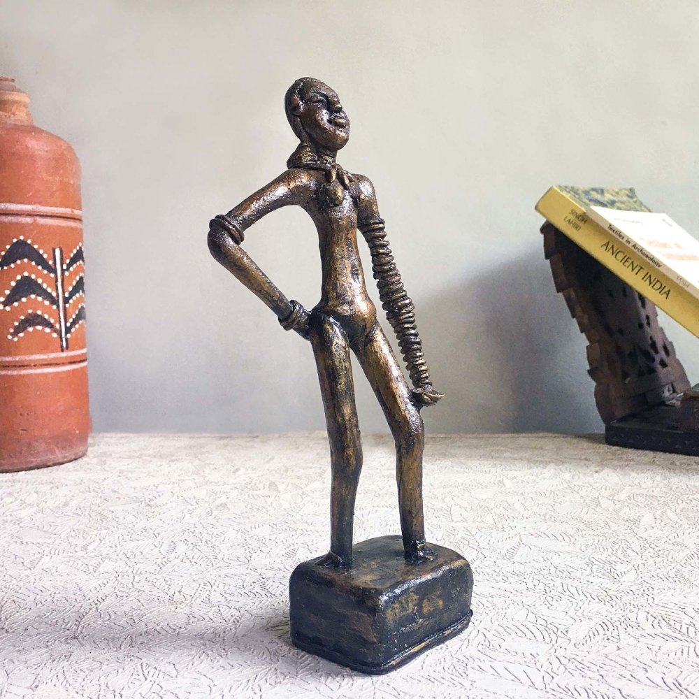 Dhokra metal replica of the iconic Harappan Dancing Girl sculpture, showcasing the intricate details 