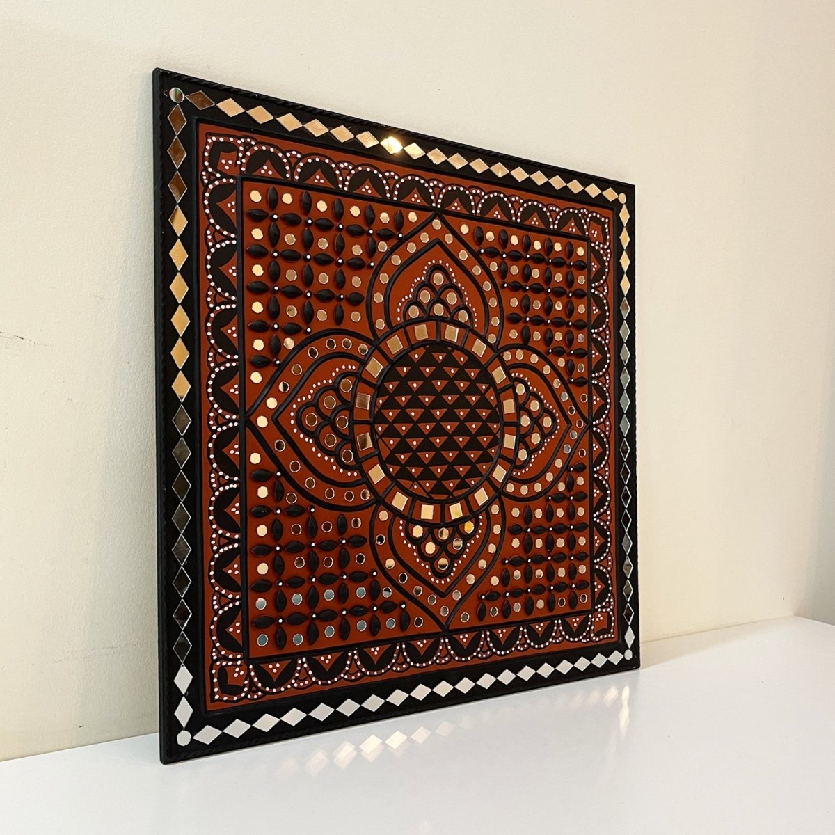 Handmade earthen sparkle mud art wall hanging, adding a rustic and shimmering touch 