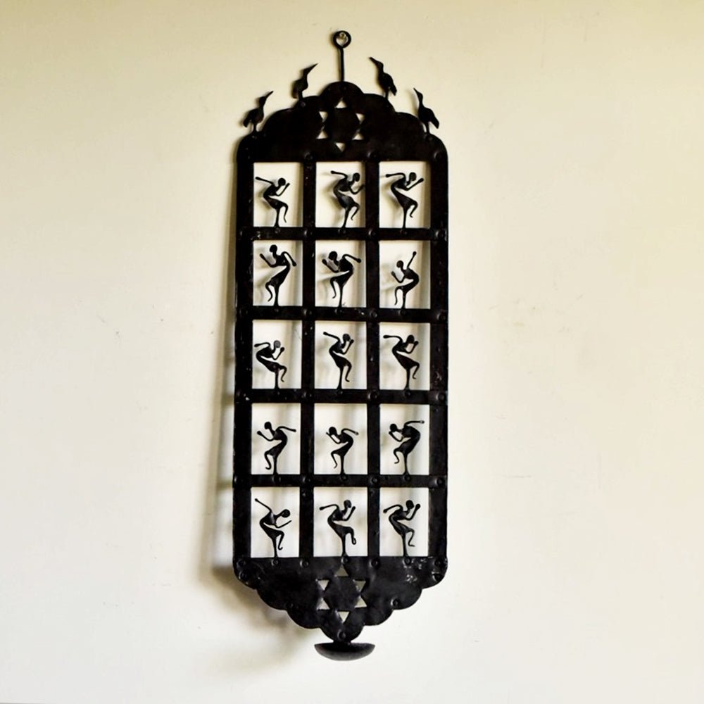 Handcrafted candle stand inspired by Bastar tribal art, featuring intricate designs