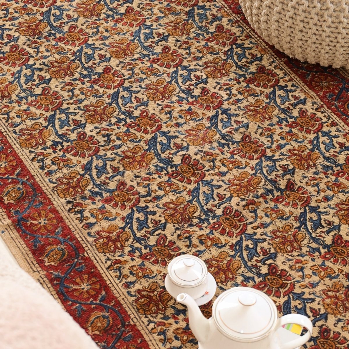Handcrafted Kalamkari Print Cotton Rug with a Maroon, Beige, and Blue Floral Design
