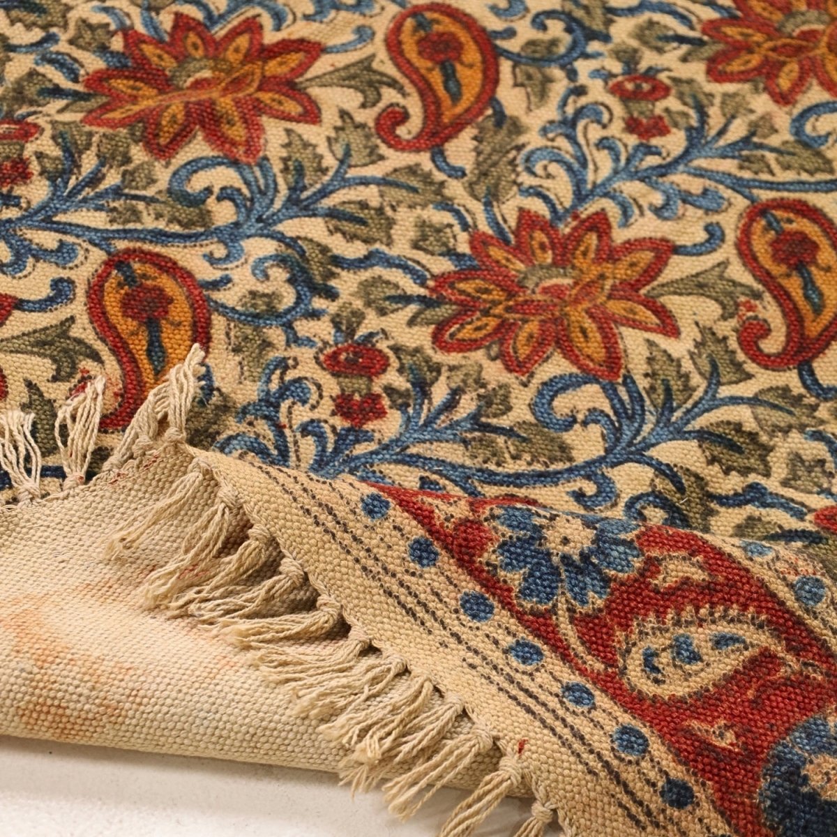 Handcrafted Kalamkari Print Cotton Rug with a Paisley Pattern in Red, Blue, and Beige