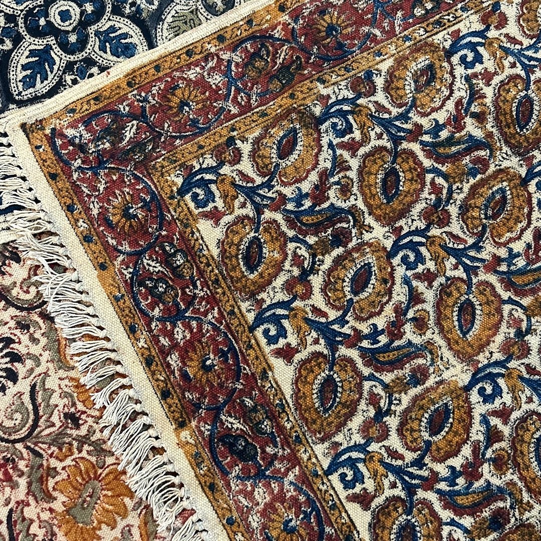 Handmade Cotton Rugs With A Floral Kalamkari Print In Ochre And Indigo | Handmade In India