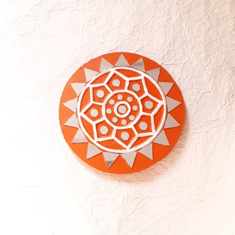 Artisanal set of 2 round bright brick-colored handcrafted mud and mirror work wall art pieces