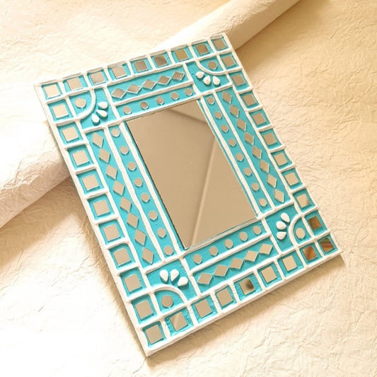 Decorative turquoise handcrafted mud and mirror work wall mirror, perfect for adding a pop of color