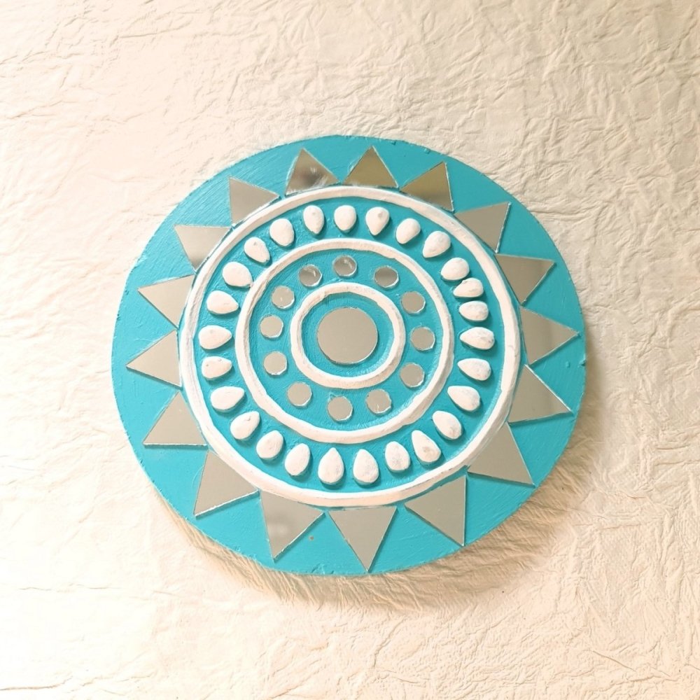 Set of 2 round turquoise handcrafted mud and mirror work wall decor pieces, featuring intricate design