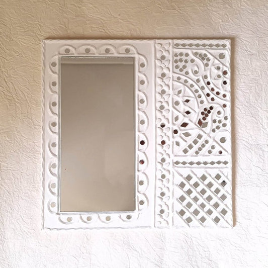 Handcrafted white mud art wall decor mirror, adding a rustic and artistic touch to your wall