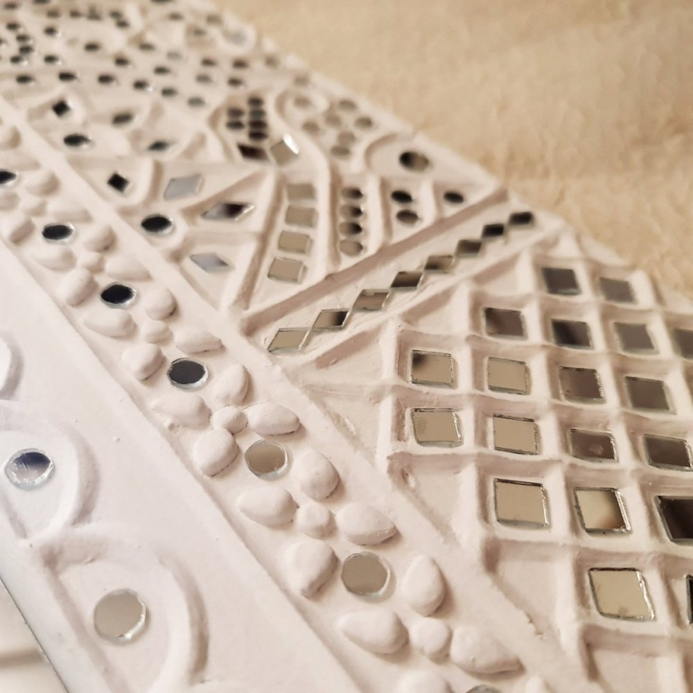 White handcrafted mud art wall decor mirror, featuring a unique blend of color