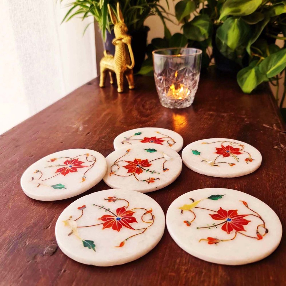 Coral marble inlay coasters inspired by the Taj Mahal, adding elegance to your tabletop decor