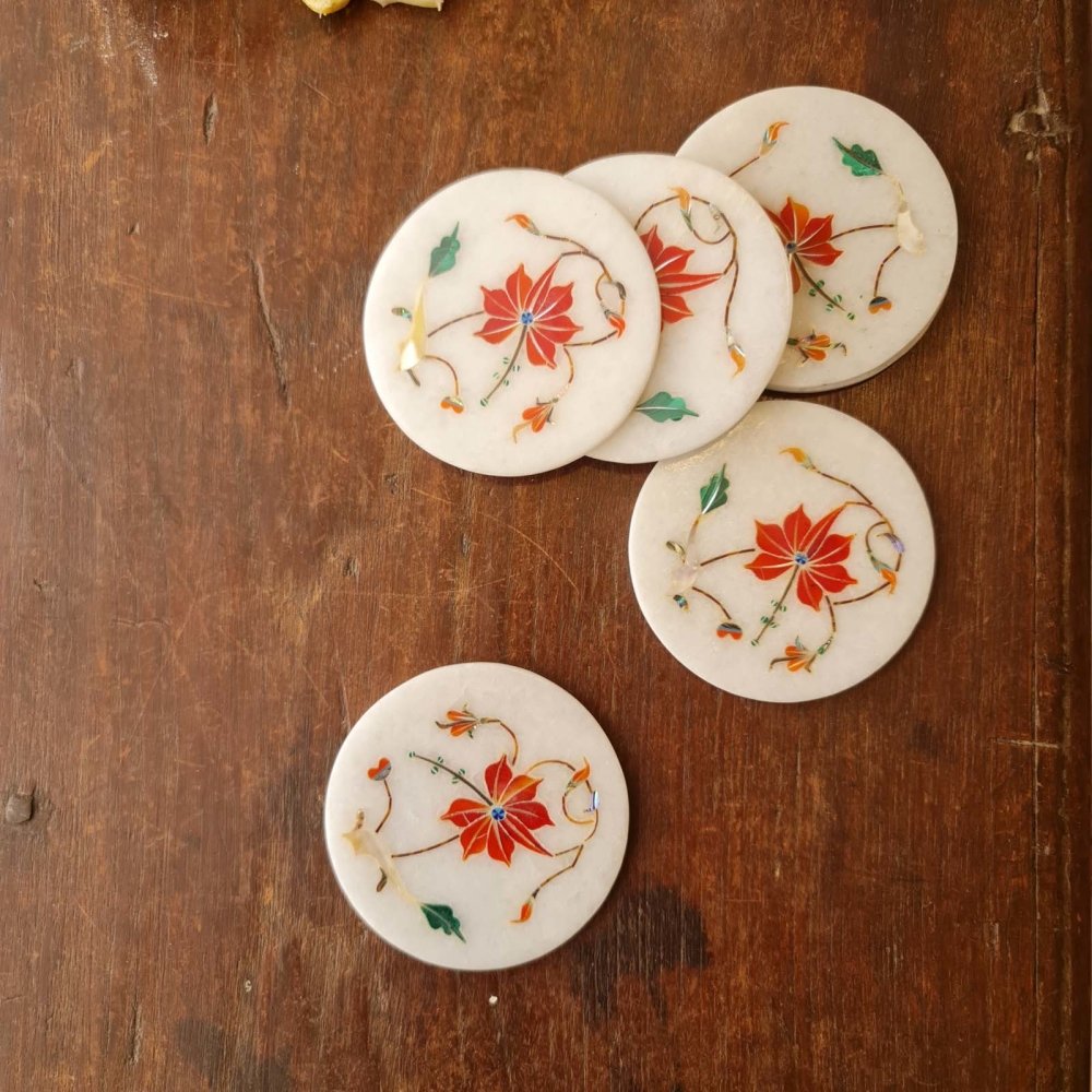 Decorative coral marble inlay coasters inspired by the Taj Mahal, perfect for a touch of luxury