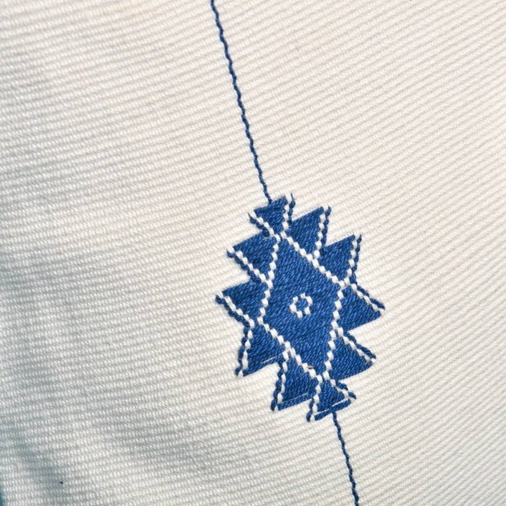 Serene Blooms: Blue on White Floral Handwoven Cushion Cover